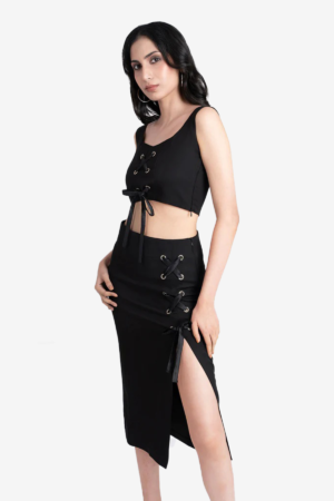 Black co-ord set, crop top and skirt. Crop top is sleeveless, has side zip and rivets on front with satin ribbon, sweetheart neckline. Length of the skirt is midi length, has side slit, rivets with ribbon on the side. very comfortable, easy to wear. Suitable for party, dinner.