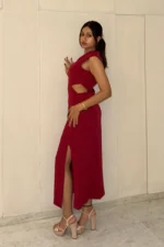 Red midi dress, has waist cuts and slit on one side, it has v neckline and is sleeveless. Suitable for Formal /work wear and party. Very stylish and trendy.