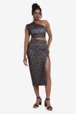 Printed coord set - one shoulder crop top and midi skirt. Set has geometric print on it with multicolor. Top is one shoulder crop top and side zip. Skirt has one side slit. Very comfortable, stylish and easy to wear. Suitable for party.