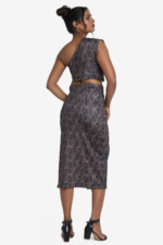 Printed coord set - one shoulder crop top and midi skirt. Set has geometric print on it with multicolor. Top is one shoulder crop top and side zip. Skirt has one side slit. Very comfortable, stylish and easy to wear. Suitable for party.