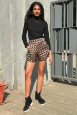Printed coord set has crop shirt, shorts and a tie in gold and black color. Crop Shirt has full sleeves, collar, cuff and buttons at front it comes with a tie and same color shorts. Very comfortable, trendy can be styled in multiple different ways like formal wear/work wear, casual or party.