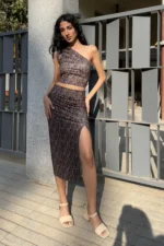 Printed coord set - one shoulder crop top and midi skirt. Set has geometric print on it with multicolor. Top is one shoulder crop top and side zip. Skirt has one side slit. Very comfortable, stylish and easy to wear. Suitable for party.
