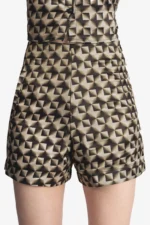 Printed coord set has crop shirt, shorts and a tie in gold and black color. Crop Shirt has full sleeves, collar, cuff and buttons at front it comes with a tie and same color shorts. Very comfortable, trendy can be styled in multiple different ways like formal wear/work wear, casual or party.
