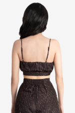 Brown co-ord set with a crop top and flared pant has geometric print on it. crop top has gathers on waist, noodle straps and side concealed zipper. Pant had side concealed zip, comfortable and relaxed fit. Suitable for women who prefer fashionable, trendy outfits and are looking for party wear.