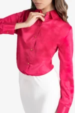 Women's formal shirt, red colored shirt has full sleeves, collar, cuff and golden buttons on front. It has rivets and satin ribbon at back. Regular fit, stylish, comfortable and easy to wear. Formal wear/ work wear.